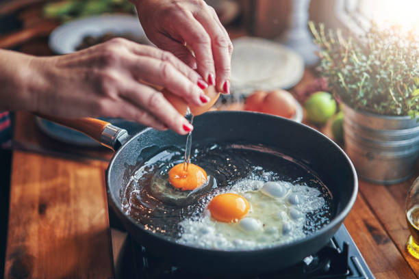 lady cooking egg